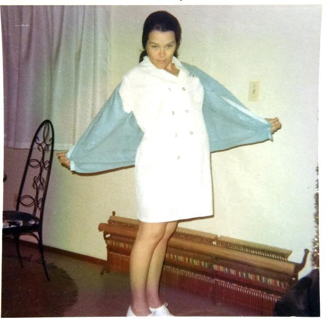 Tomasina Parrott's mother in a white one piece and blue outer.